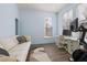 Home office with hardwood floors, built-in desk, and exercise bike at 836 Lake Evalyn Dr, Celebration, FL 34747