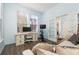 Home office with hardwood floors, built-in desk, and French doors at 836 Lake Evalyn Dr, Celebration, FL 34747