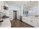 Eat-in kitchen with island, stainless steel appliances, and hardwood floors at 836 Lake Evalyn Dr, Celebration, FL 34747