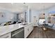 Modern kitchen with breakfast nook, island, and stainless steel appliances at 836 Lake Evalyn Dr, Celebration, FL 34747