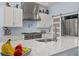 Modern kitchen featuring stainless steel appliances and quartz countertops at 836 Lake Evalyn Dr, Celebration, FL 34747