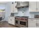 Modern kitchen with Wolf range and stylish stainless steel appliances at 836 Lake Evalyn Dr, Celebration, FL 34747