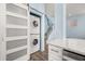Stackable washer and dryer tucked away behind barn doors at 836 Lake Evalyn Dr, Celebration, FL 34747