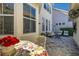 Patio with seating, table, and flowers at 836 Lake Evalyn Dr, Celebration, FL 34747