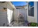Cozy patio with seating area, table, and brick pavers at 836 Lake Evalyn Dr, Celebration, FL 34747