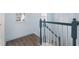 Modern staircase with a teal handrail and white balusters at 836 Lake Evalyn Dr, Celebration, FL 34747
