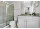 Clean bathroom with a shower and granite countertop at 8939 Zurich Ln, Kissimmee, FL 34747