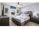 Main bedroom with a king-size bed and wood accents at 8939 Zurich Ln, Kissimmee, FL 34747