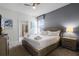 King bed in bedroom with ensuite bathroom access at 8939 Zurich Ln, Kissimmee, FL 34747
