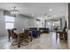 Open concept dining room with a rustic wooden table and seating for six at 8939 Zurich Ln, Kissimmee, FL 34747