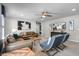 Living room with brown leather couches and a large TV at 8939 Zurich Ln, Kissimmee, FL 34747