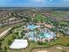 Breathtaking aerial view of the community with resort-style pool, splash pad, volleyball court and extensive residences at 8976 Azalea Sands Ln # 2604, Davenport, FL 33896