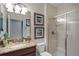 Modern bathroom with granite counters, shower, toilet and decorative artwork, with a clean and functional design at 8976 Azalea Sands Ln # 2604, Davenport, FL 33896