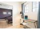 Office with a glimpse into a well-lit and comfortable bedroom at 8976 Azalea Sands Ln # 2604, Davenport, FL 33896