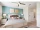 Bright bedroom with a king-sized bed, matching nightstands, and stylish decor, providing a comfortable and inviting atmosphere at 8976 Azalea Sands Ln # 2604, Davenport, FL 33896