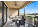 This outdoor patio features chairs, ceiling fan, table and overlooks a picturesque golf course at 8976 Azalea Sands Ln # 2604, Davenport, FL 33896