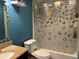 Colorful bathroom featuring a shower and tub at 974 Feather Dr, Deltona, FL 32725