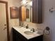 Bathroom featuring a double sink vanity and wood cabinetry at 974 Feather Dr, Deltona, FL 32725