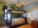 Bright bedroom featuring a bunk bed and a window at 974 Feather Dr, Deltona, FL 32725