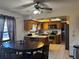 Cozy kitchen and breakfast nook with wood cabinets and a ceiling fan at 974 Feather Dr, Deltona, FL 32725