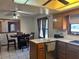 A Kitchen and dining nook featuring wood cabinets and lots of natural light at 974 Feather Dr, Deltona, FL 32725