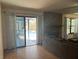 Living room featuring a fireplace and sliding glass door to the screened-in pool area at 974 Feather Dr, Deltona, FL 32725