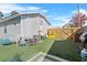 Fenced backyard with artificial turf and play area at 1001 11Th St, St Cloud, FL 34769
