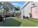 Artificial turf backyard with seating area and grill at 1001 11Th St, St Cloud, FL 34769