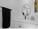 Vanity with modern sink and a large round mirror at 1001 11Th St, St Cloud, FL 34769
