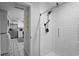 Clean bathroom with a modern shower and patterned floor at 1001 11Th St, St Cloud, FL 34769