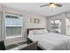 Bright bedroom with large windows, a king-size bed, and hardwood floors at 1001 11Th St, St Cloud, FL 34769