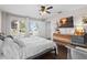Bedroom with king-size bed, hardwood floors, and access to backyard at 1001 11Th St, St Cloud, FL 34769