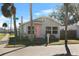 Quaint bungalow with pink door and brick-paved street at 1001 11Th St, St Cloud, FL 34769