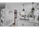 Modern kitchen with white cabinets, quartz countertops and a breakfast bar at 1001 11Th St, St Cloud, FL 34769