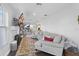 Bright living room with sectional sofa and view into kitchen at 1001 11Th St, St Cloud, FL 34769