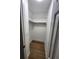 Walk-in closet with wood floor and shelving at 10232 Turkey Lake Rd # 180, Orlando, FL 32819
