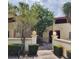 Charming courtyard entrance to home with mature trees and black iron gate at 10232 Turkey Lake Rd # 180, Orlando, FL 32819