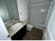 Clean bathroom featuring a bathtub and vanity at 1075 Aerides Way, Davenport, FL 33837