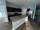 Modern kitchen with granite countertops and stainless steel appliances at 1075 Aerides Way, Davenport, FL 33837