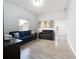 Living room with gray sofas and wood-look floors at 1109 5Th Sw St, Winter Haven, FL 33880