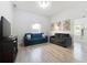 Living room with gray sofas and wood-look floors at 1109 5Th Sw St, Winter Haven, FL 33880