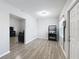 Living room with gray sofas and wood-look floors at 1109 5Th Sw St, Winter Haven, FL 33880
