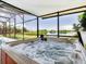 Hot tub with scenic lake view at 111 Robbins Rest Pl, Davenport, FL 33837