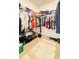 Large walk-in closet with ample storage for clothing and shoes at 15079 Willow Arbor Cir, Orlando, FL 32824