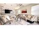 Spacious living room with comfortable furniture, a ceiling fan, and modern decor at 15079 Willow Arbor Cir, Orlando, FL 32824
