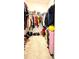 Spacious walk-in closet featuring ample storage space, rods, and shelving for organized clothing and accessories at 15079 Willow Arbor Cir, Orlando, FL 32824