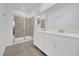 Modern bathroom with double vanity and walk-in shower at 16567 Parable Way, Winter Garden, FL 34787