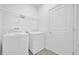 Laundry room with washer, dryer, and overhead shelving at 16567 Parable Way, Winter Garden, FL 34787