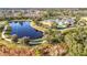 Aerial view of community with pond and walking paths at 17863 Passionflower Cir, Clermont, FL 34714