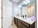 Double vanity bathroom with a sleek design and updated finishes at 17863 Passionflower Cir, Clermont, FL 34714